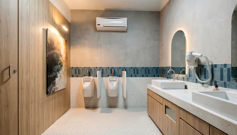Restroom finished in timber and textured plaster
