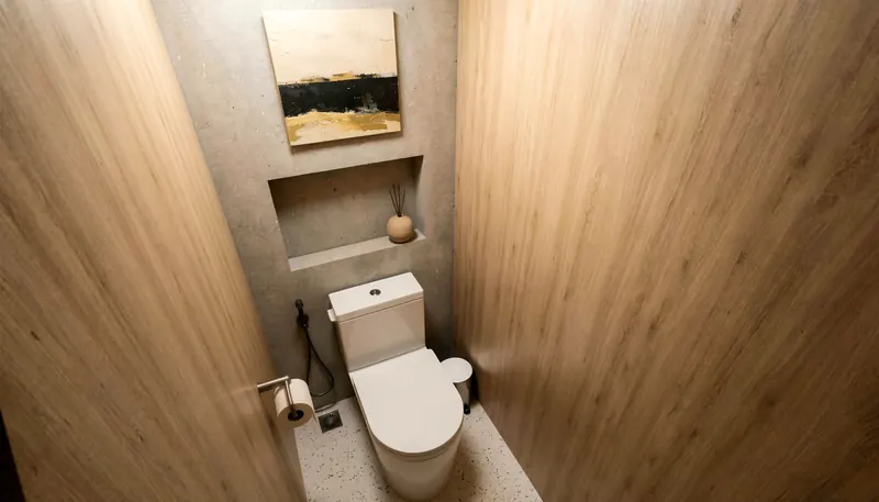 Toilet cubicle lined in timber